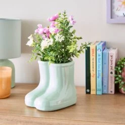 Artificial Floral Arrangement In Ceramic Wellington Boot